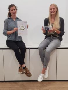 Marie with her friend after their presentation on sustainability